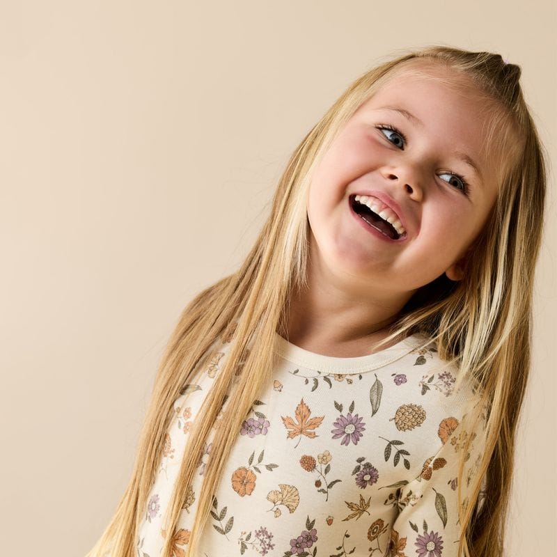 Unisex Maple Glow Organic long-sleeved pajamas by Wilson & Frenchy, soft sleepwear with a cozy maple leaf design.