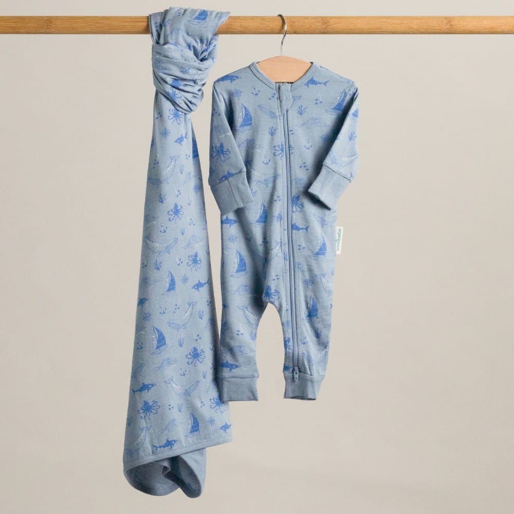 Unisex Woolbabe Merino and organic cotton PJ suit in Glacier Sail Away pattern, cozy sleepwear for all genders.