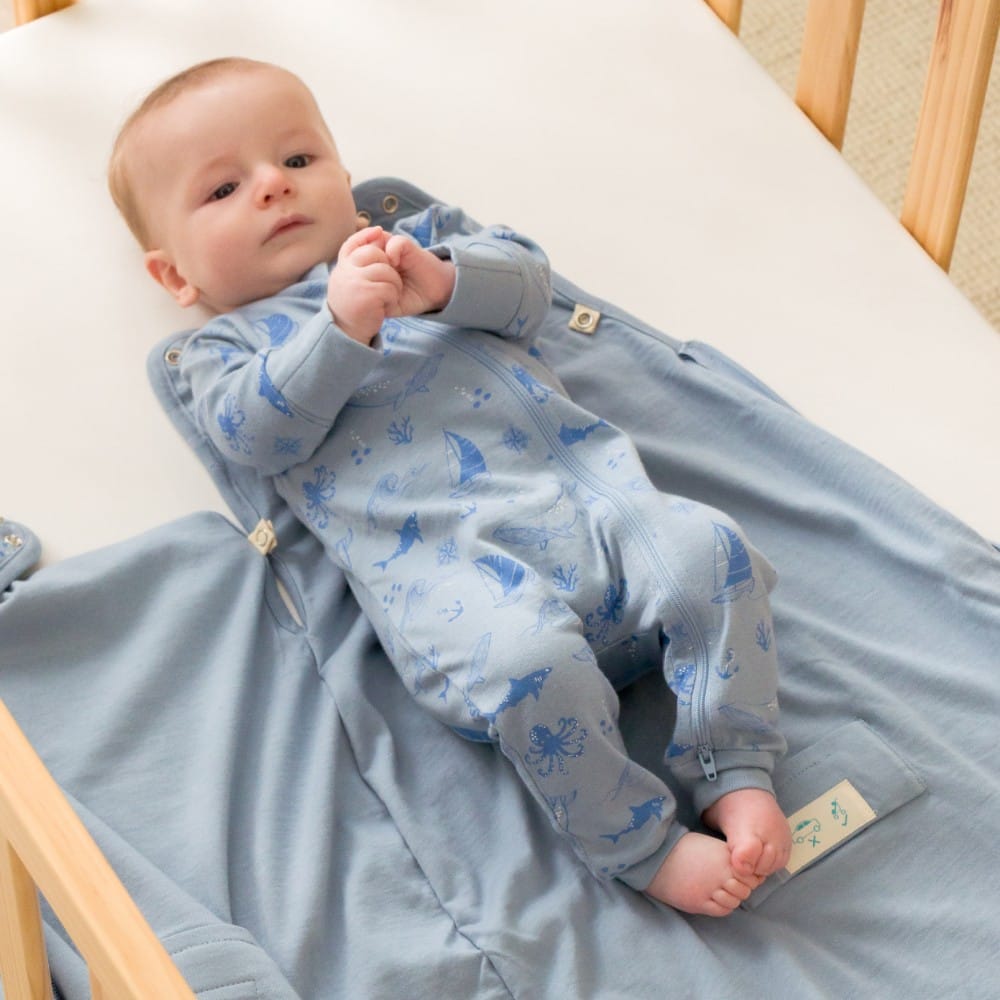 Unisex Woolbabe Merino and organic cotton PJ suit in Glacier Sail Away pattern, cozy sleepwear for all genders.
