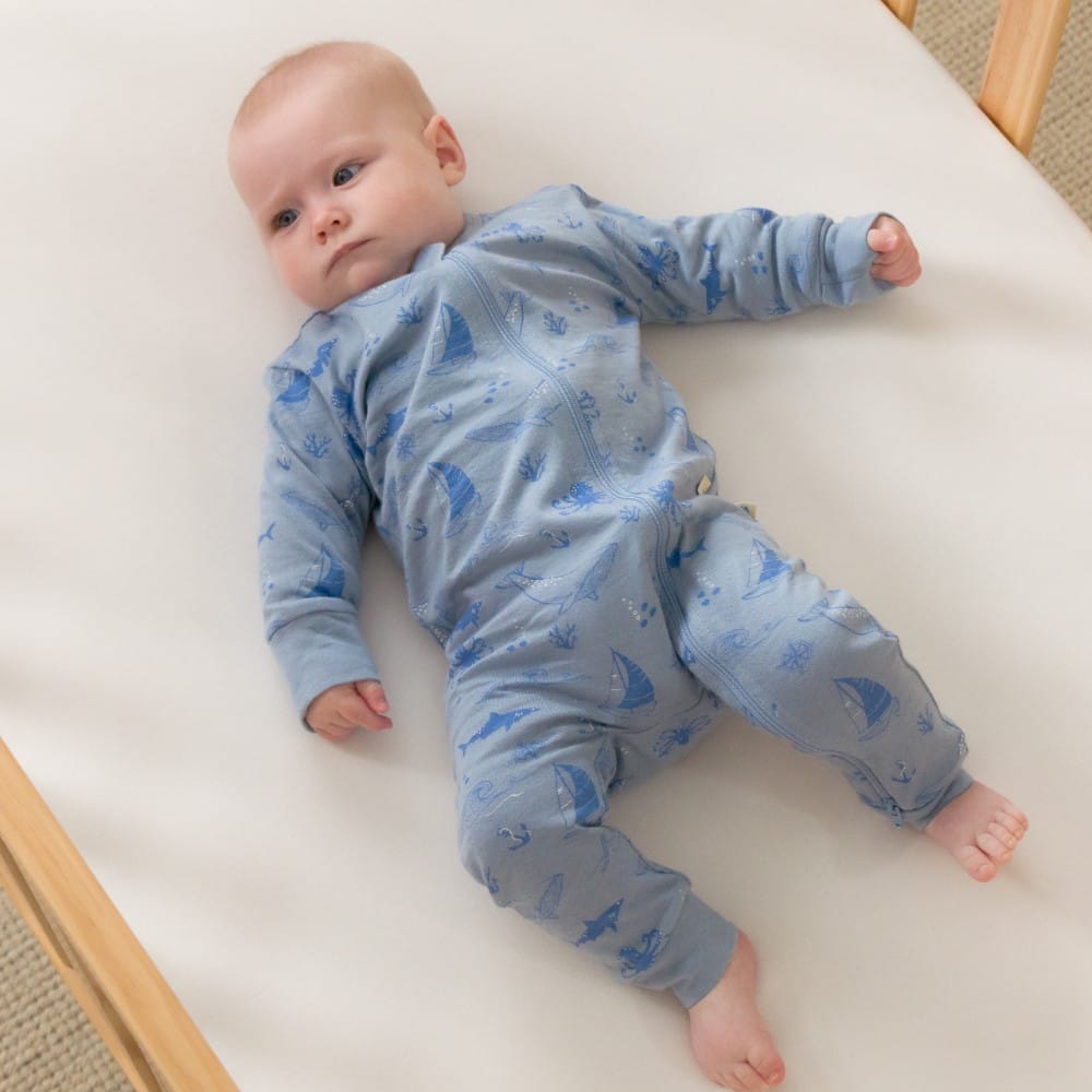 Unisex Woolbabe Merino and organic cotton PJ suit in Glacier Sail Away design, cozy sleepwear for comfortable nights.