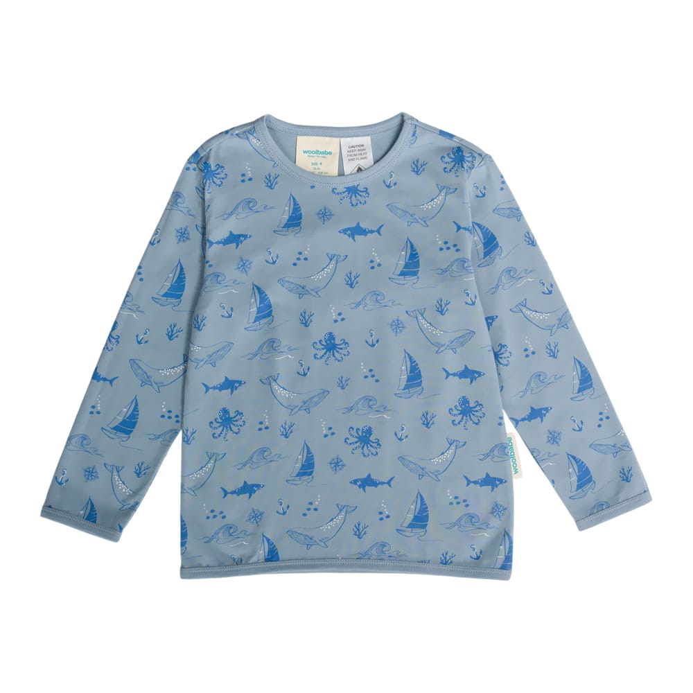 Unisex Woolbabe winter pajamas made of merino and organic cotton with a Glacier Sail Away pattern, cozy sleepwear for cold nights.